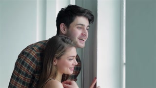 A joyful couple moving into their new home