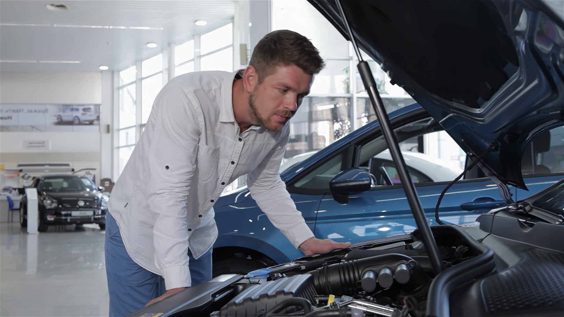 Man Inspects Engine Compartment Of Sleek Car Stock Footage SBV ...