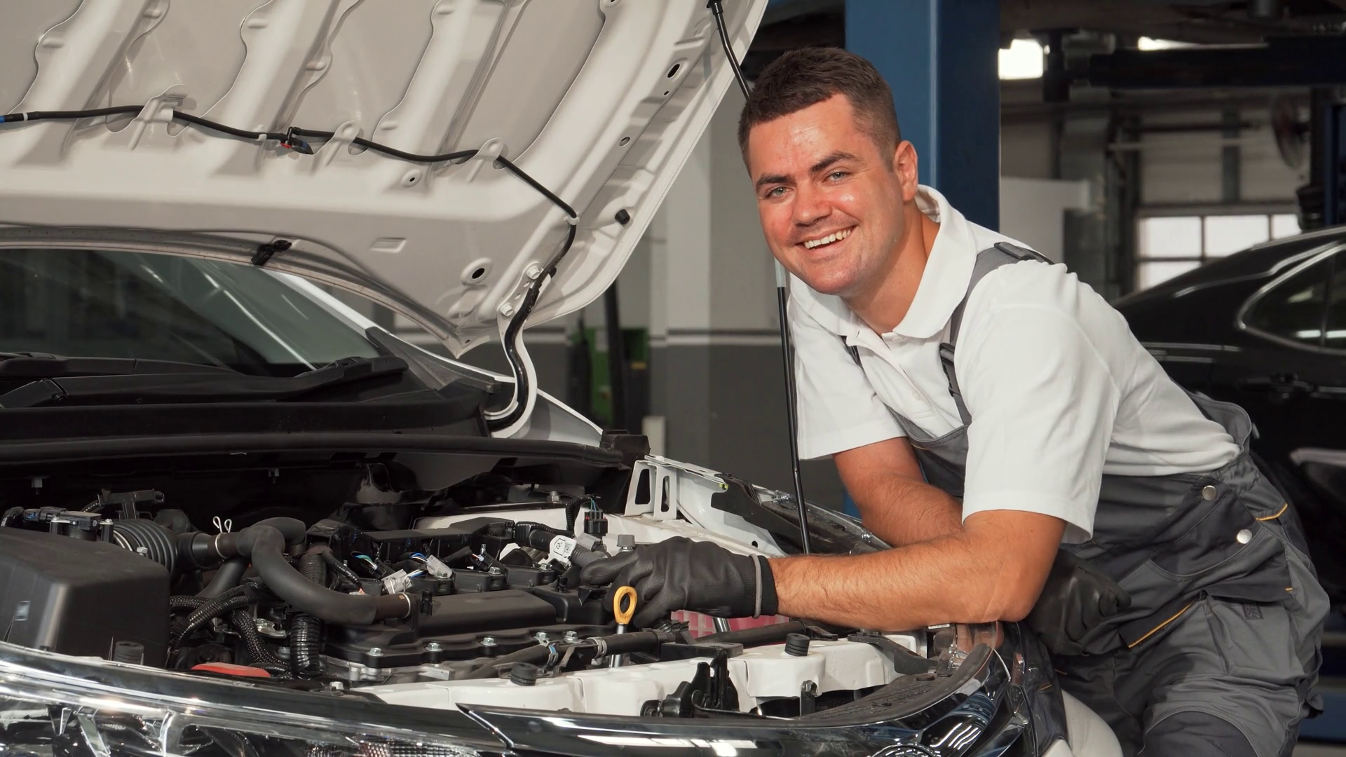 Joyful Mechanic Immersed In Work At Bustling Stock Footage SBV ...