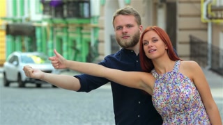 Tourists traveling hitchhiking