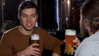 Friends enjoying a refreshing drink together, toasting