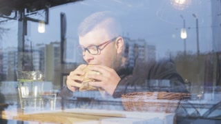 Man Eating a Burger