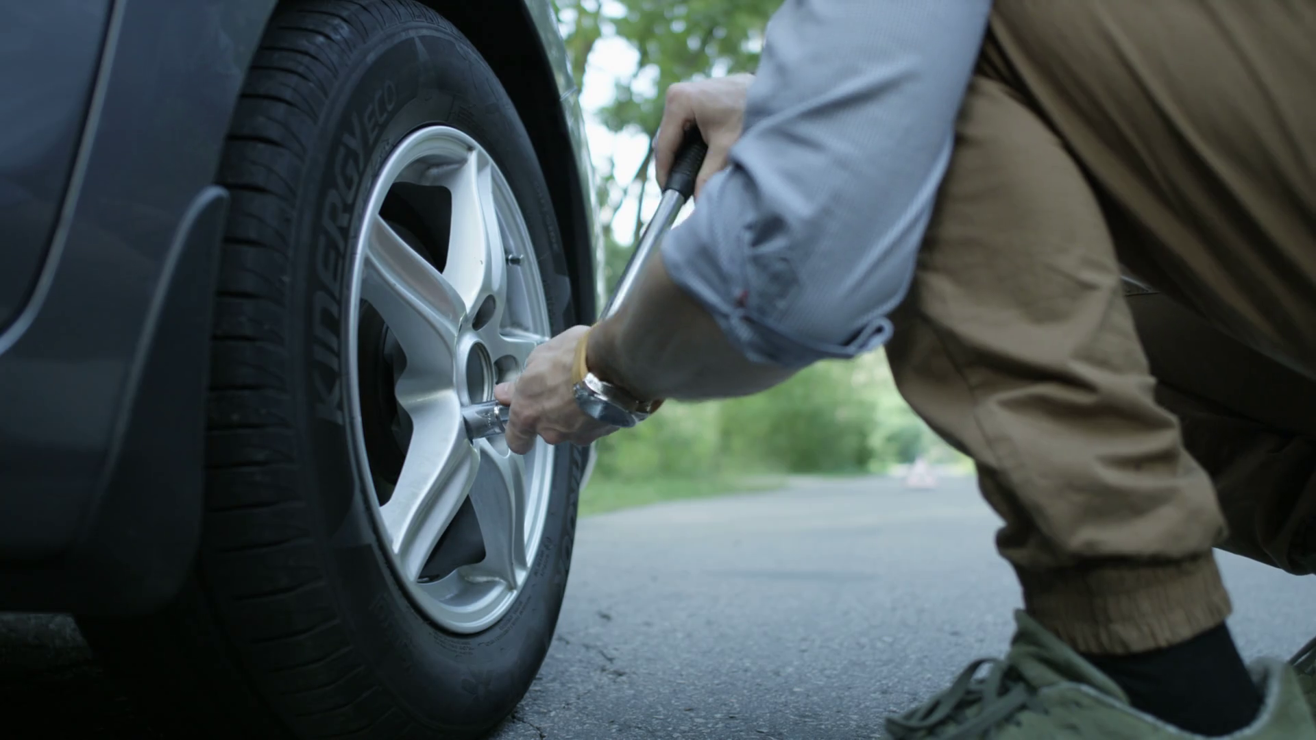 Changing Tire Hands Of Man Loosening Wheel Stock Footage SBV317402357