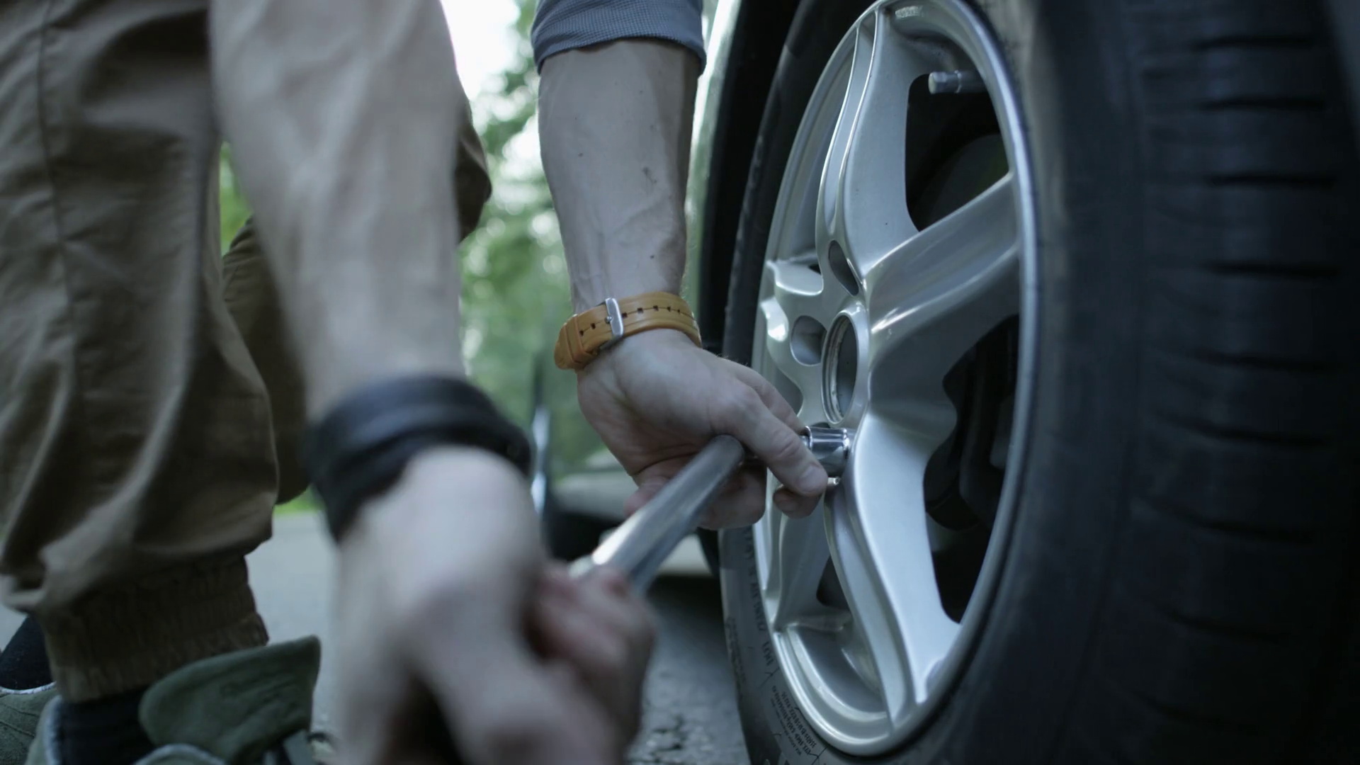 Changing Tire Hands Of Man Loosening Wheel Stock Footage SBV317402371