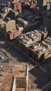 An aerial view of a city with lots of tall buildings