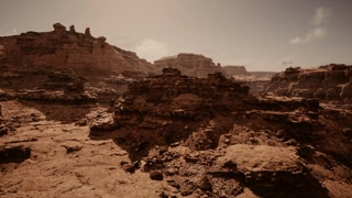 Scientists examine stratified sandstone units and gather samples for analysis