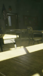 Empty classroom with sunlight shining through windows during afternoon