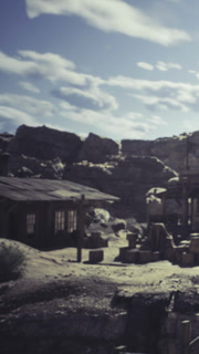 Desert town stands still under a vast sky filled with soft clouds