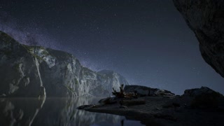 hyperlapse of night starry sky with mountain and ocean beach in Lofoten Norway