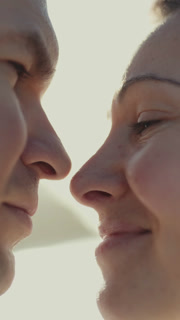 Loving couple sharing intimate moments at sunset