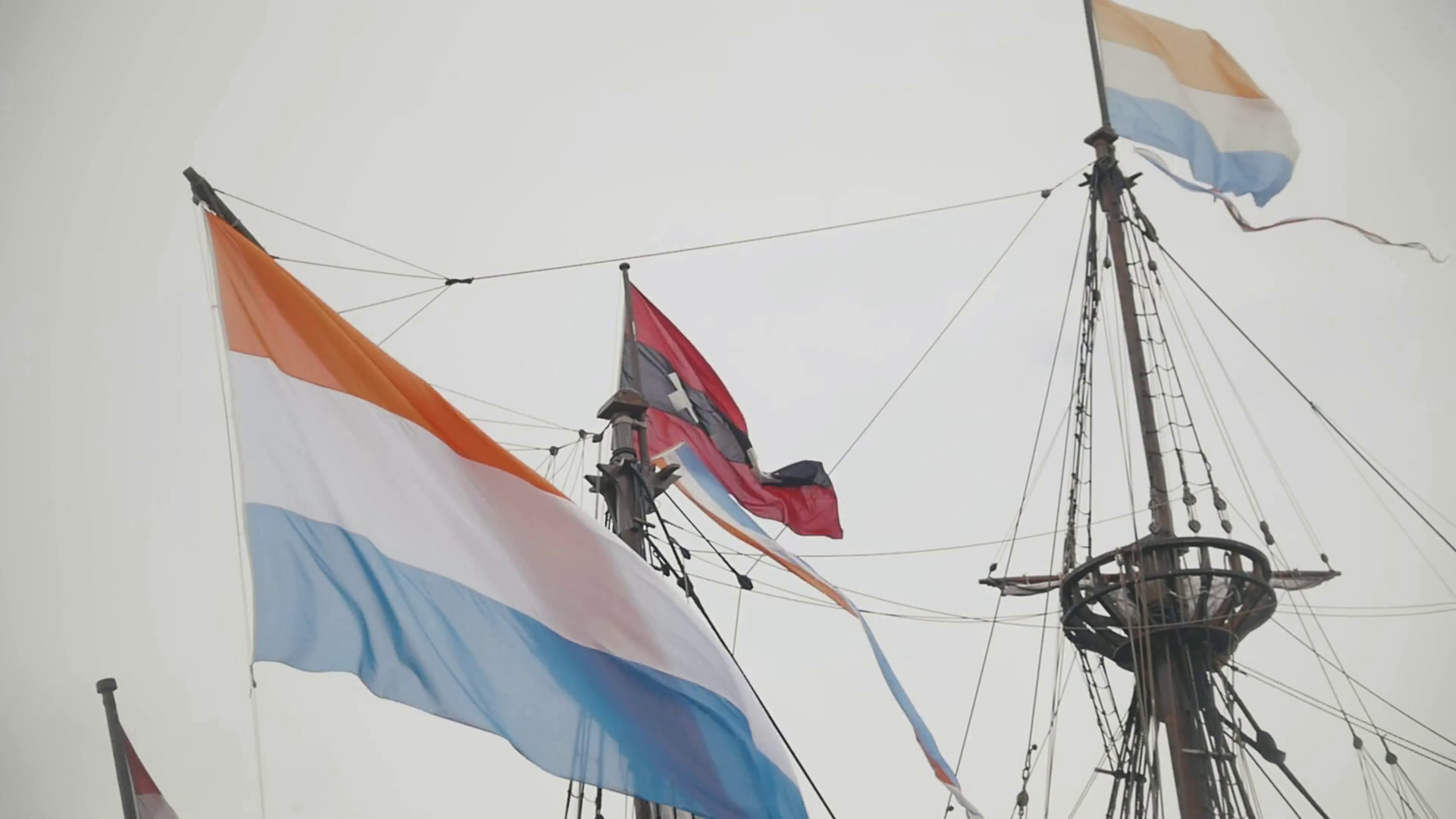 Flag of Netherlands and the symbol of Amsterdam triple x flying on
