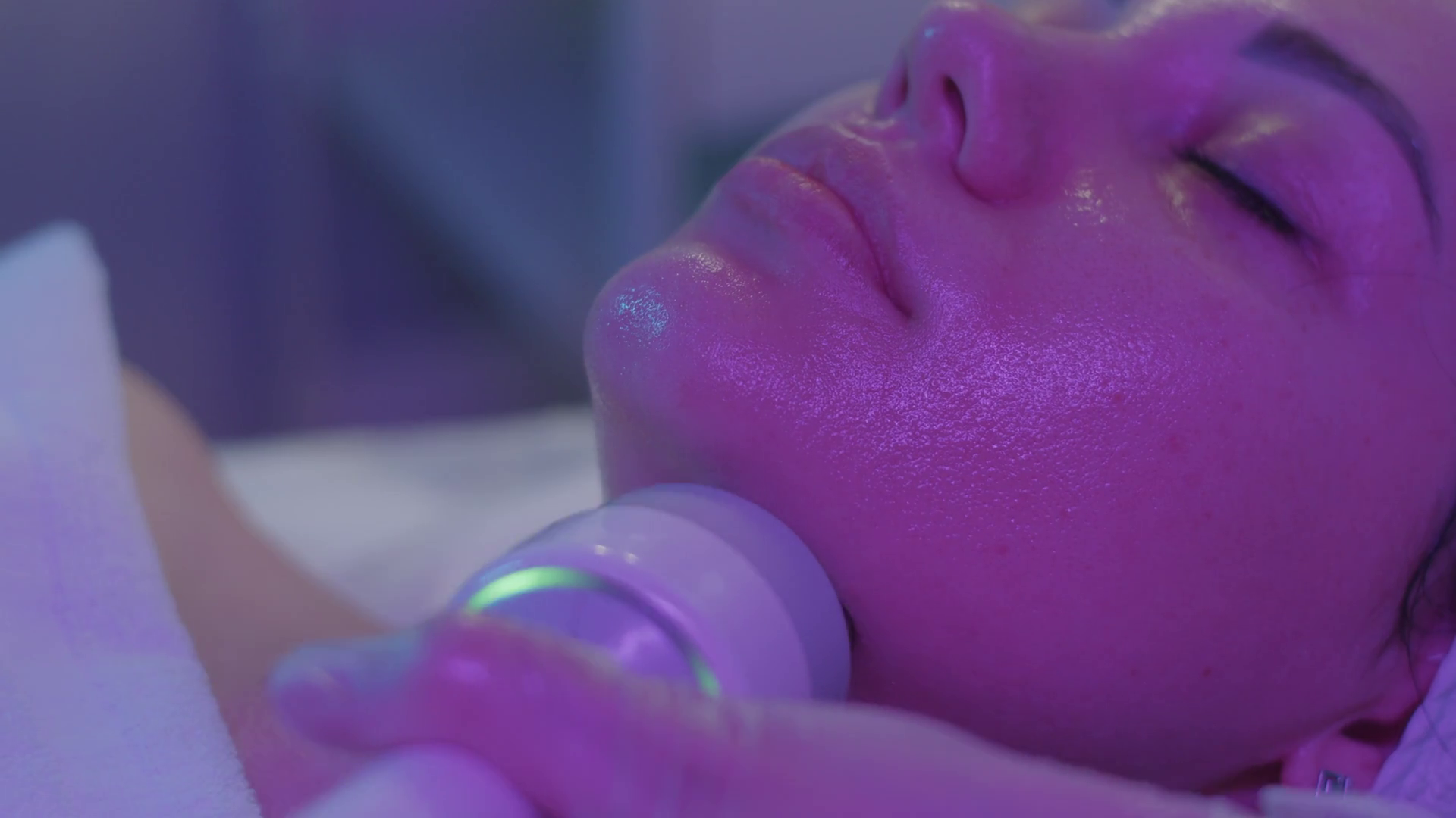 Ultrasonic Facial Cleansing In Purple Light Stock Footage SBV347721897
