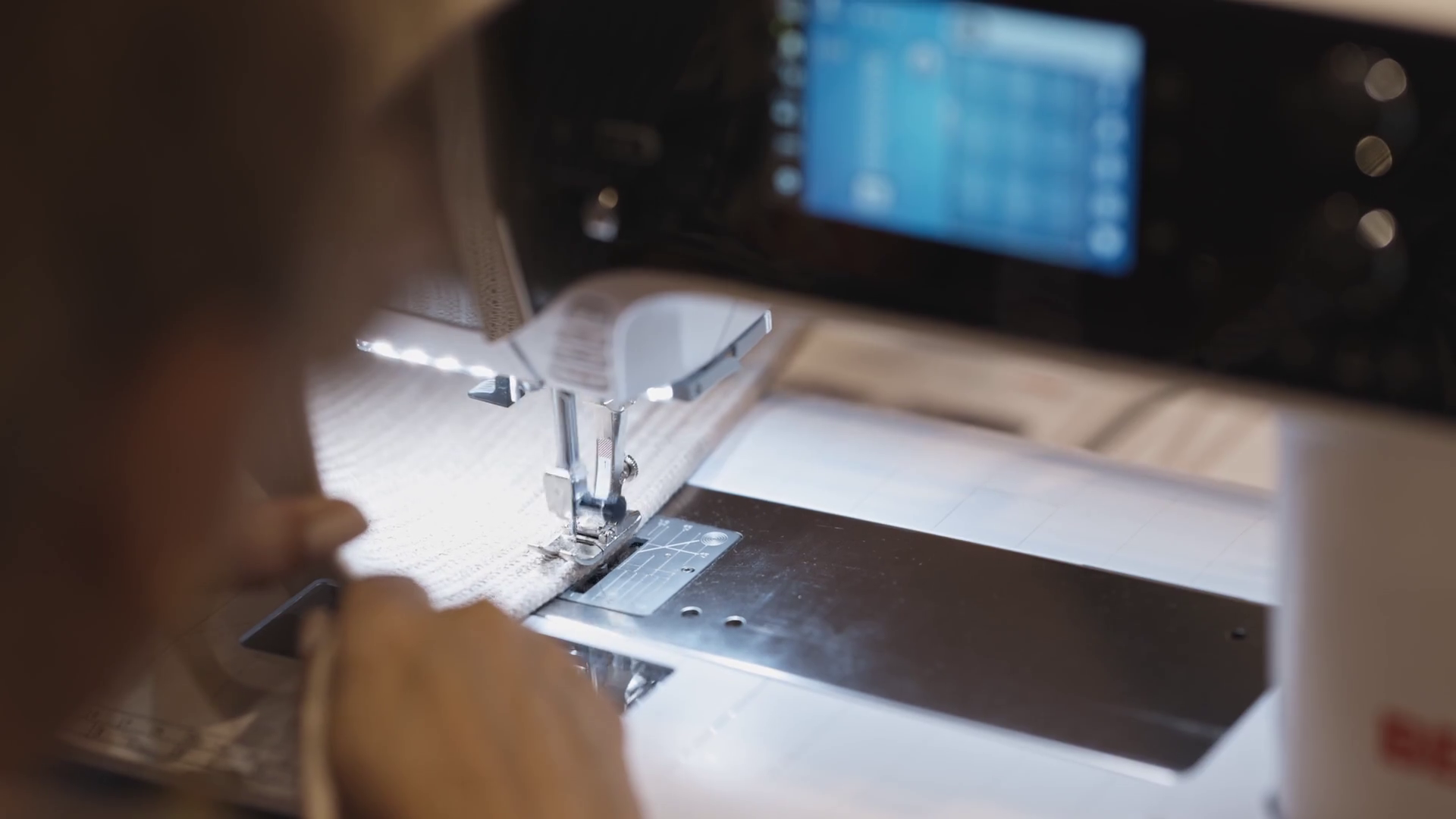 A Woman Sews At Factory Using Sewing Machine Stock Footage SBV ...