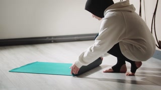 Muslim woman finishes yoga session
