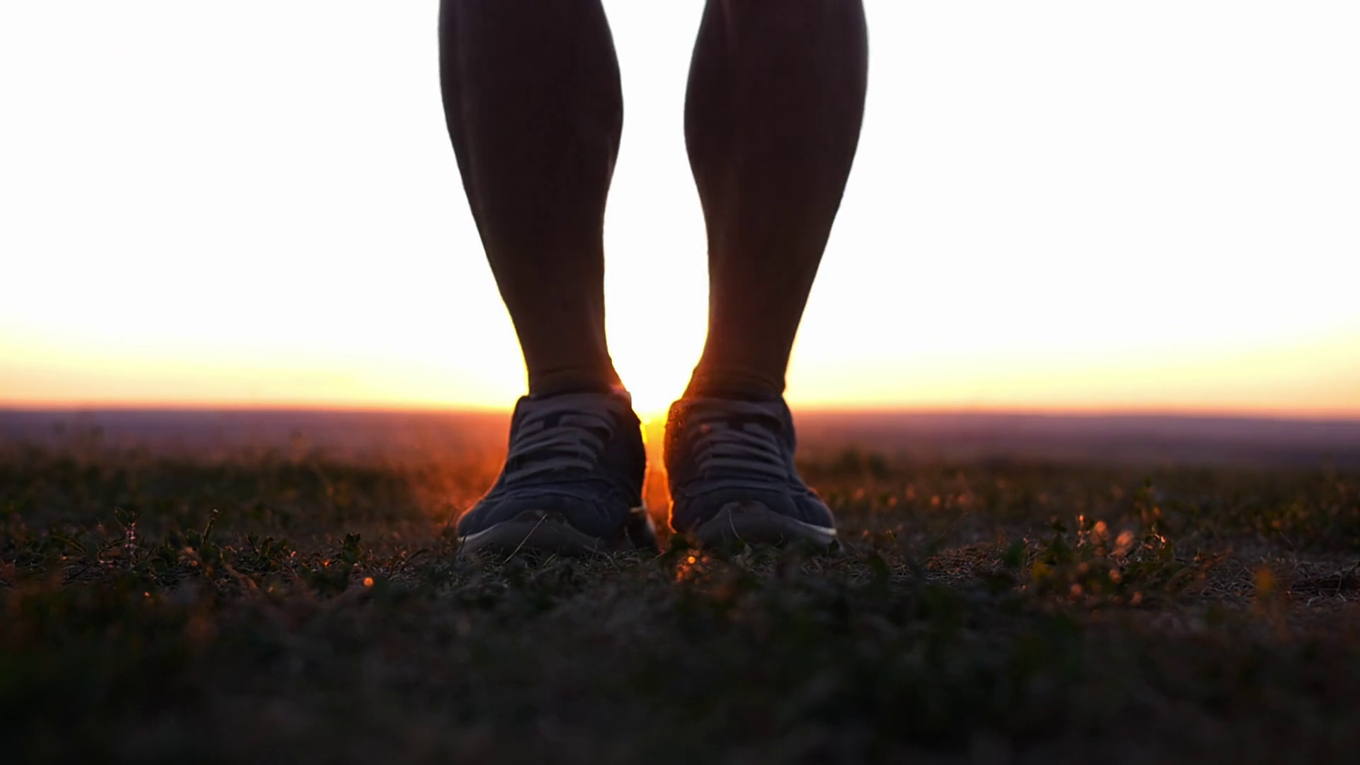A muscular man jumping over the rope on the hill at sunset Stock Video ...