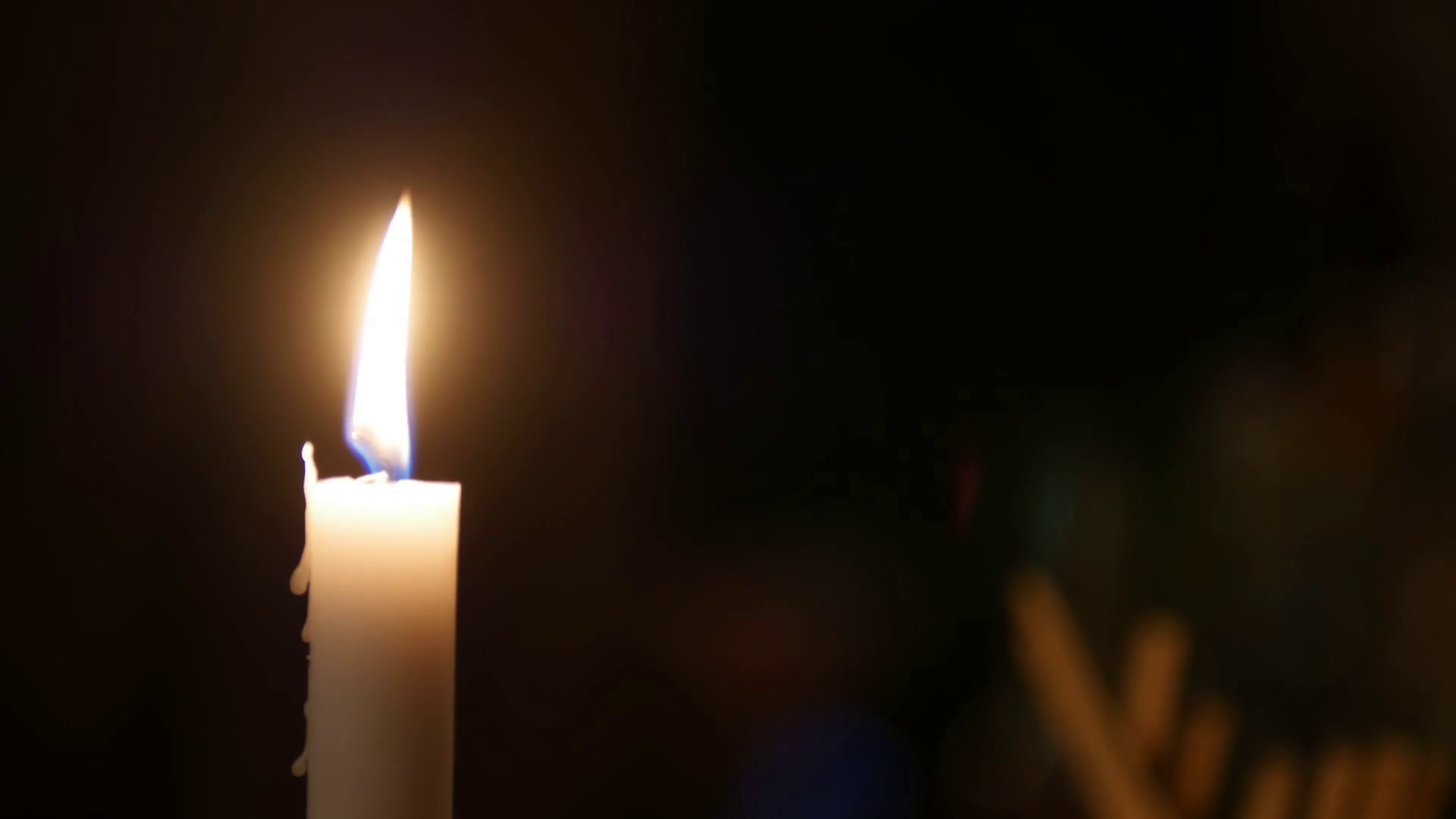 Closeup Of Candle Flame In Black Background Stock Footage SBV