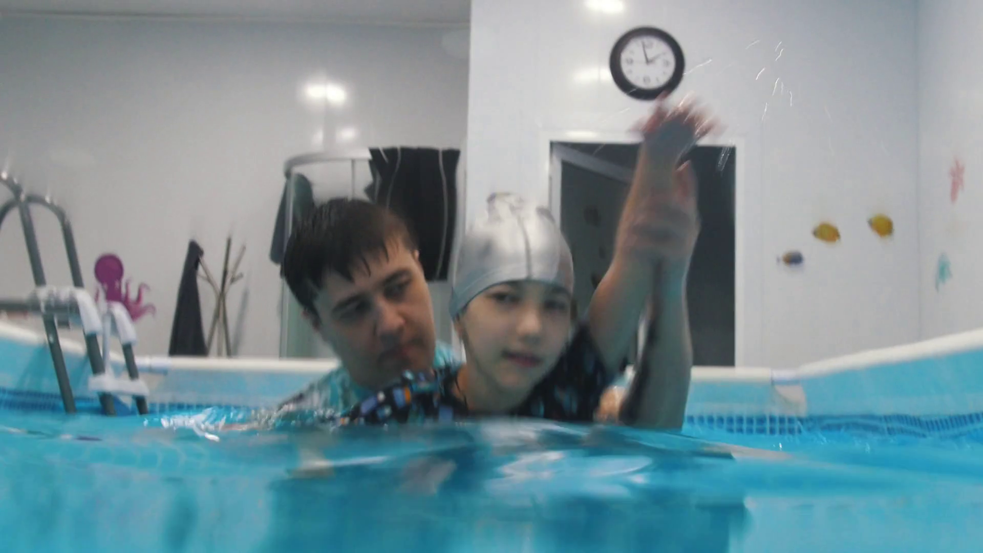 Water rehabilitation procedure with child with cerebral palsy. Doing