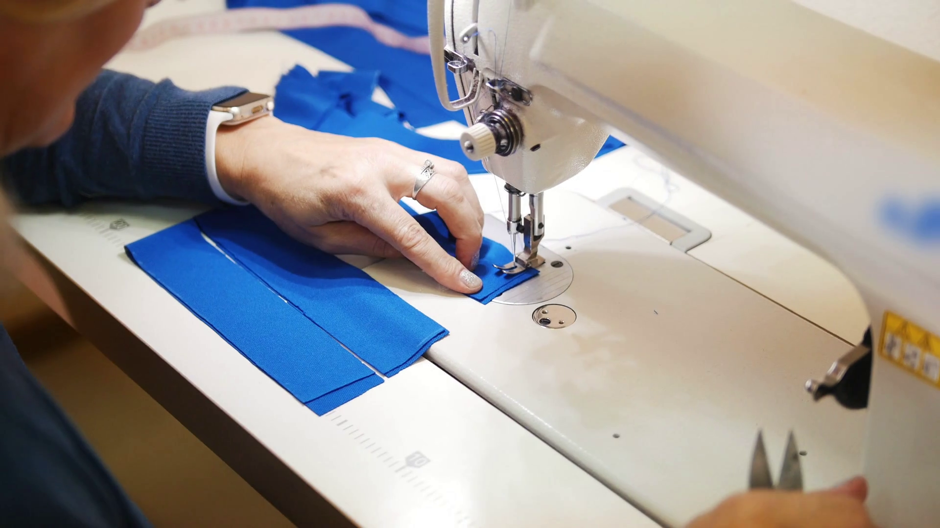Woman works with textile on Sewing Machine Stock Video Footage 0018