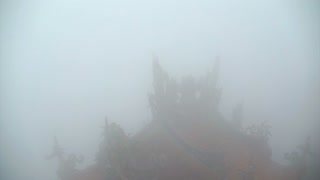 Video of Chinese temple red lanterns shining in the mist. Mysterious and spiritual architect abstract