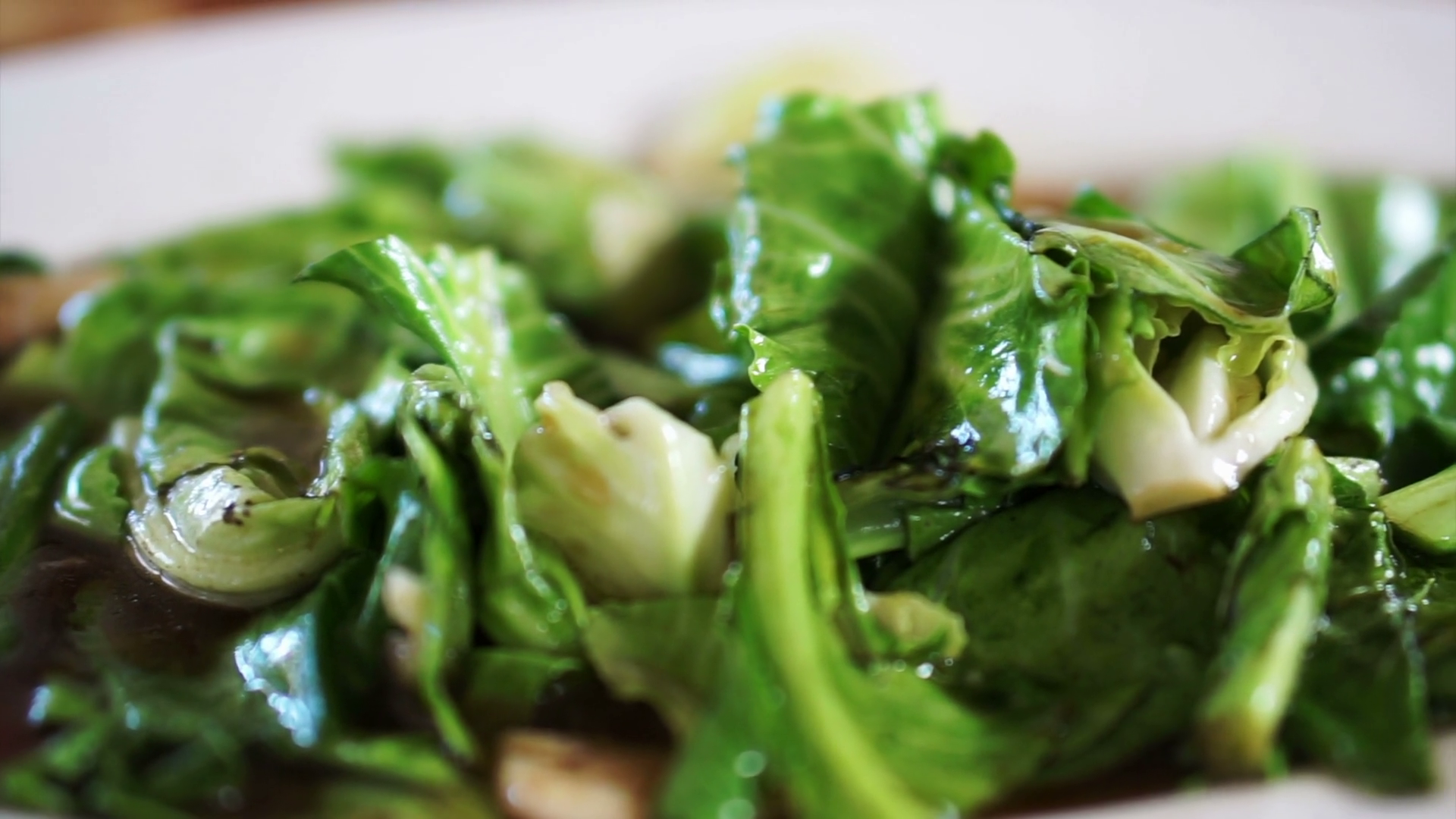 Bok choy or Chinese broccoli green vegetable stir fry with sauce in
