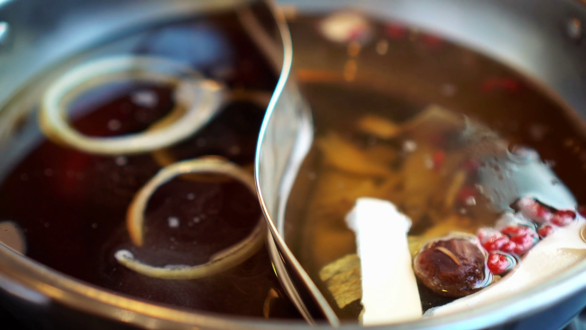 Two soups hot pot Asian style herb soup and sukiyaki boiling 4k Stock