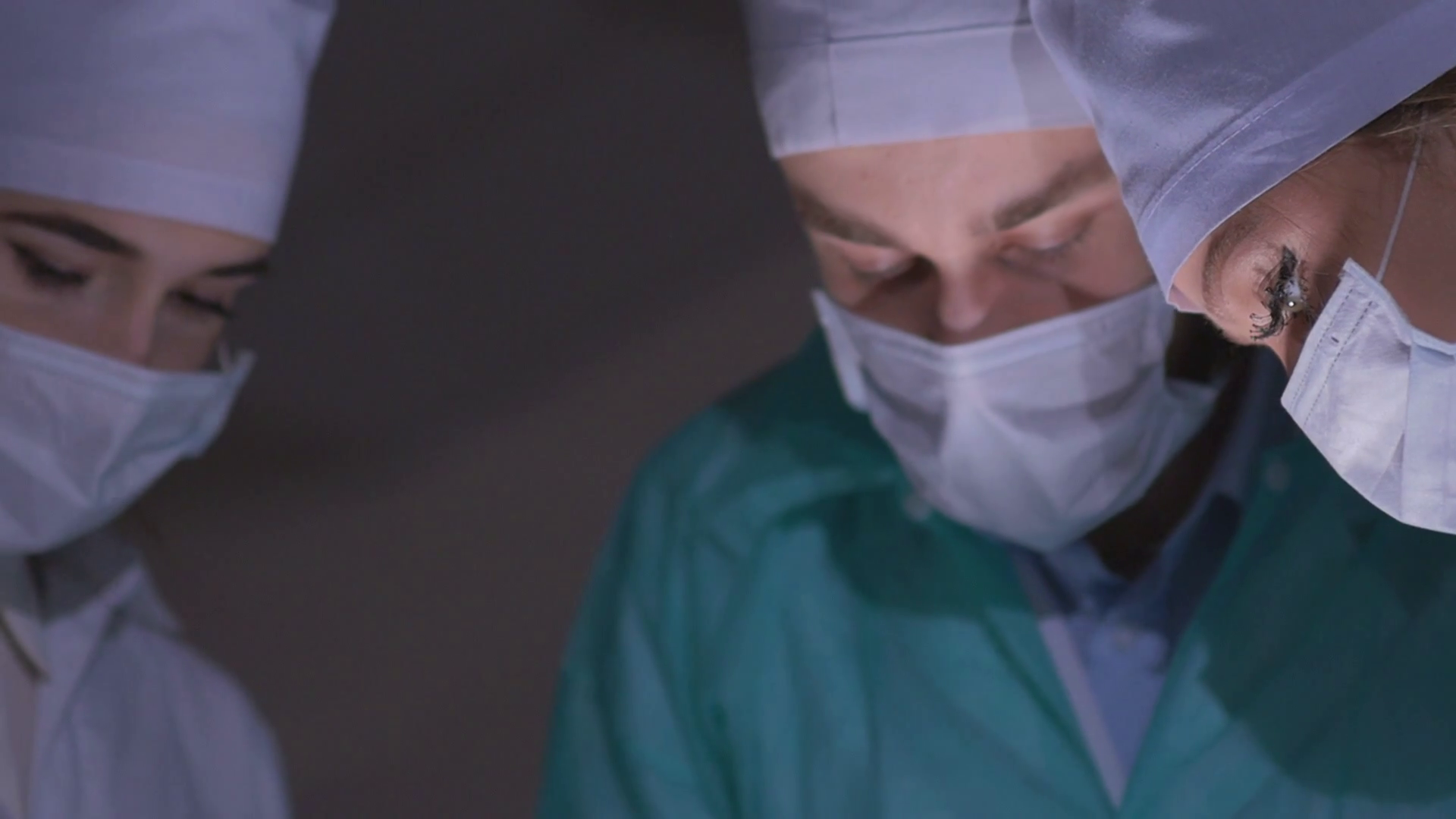 Doctors surgeons operate patient in operating theater. Surgical team