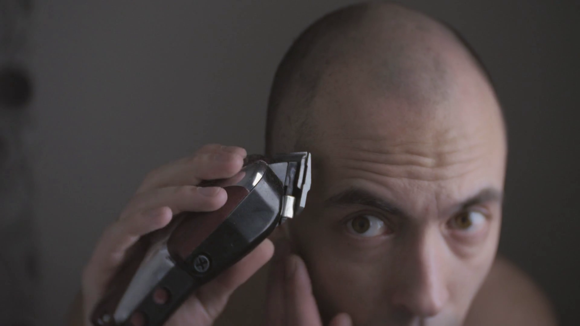 Man shaves his head with electric clippers Stock Video Footage 0013 SBV346884409 Storyblocks