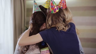Young friends surprise birthday girl with gifts