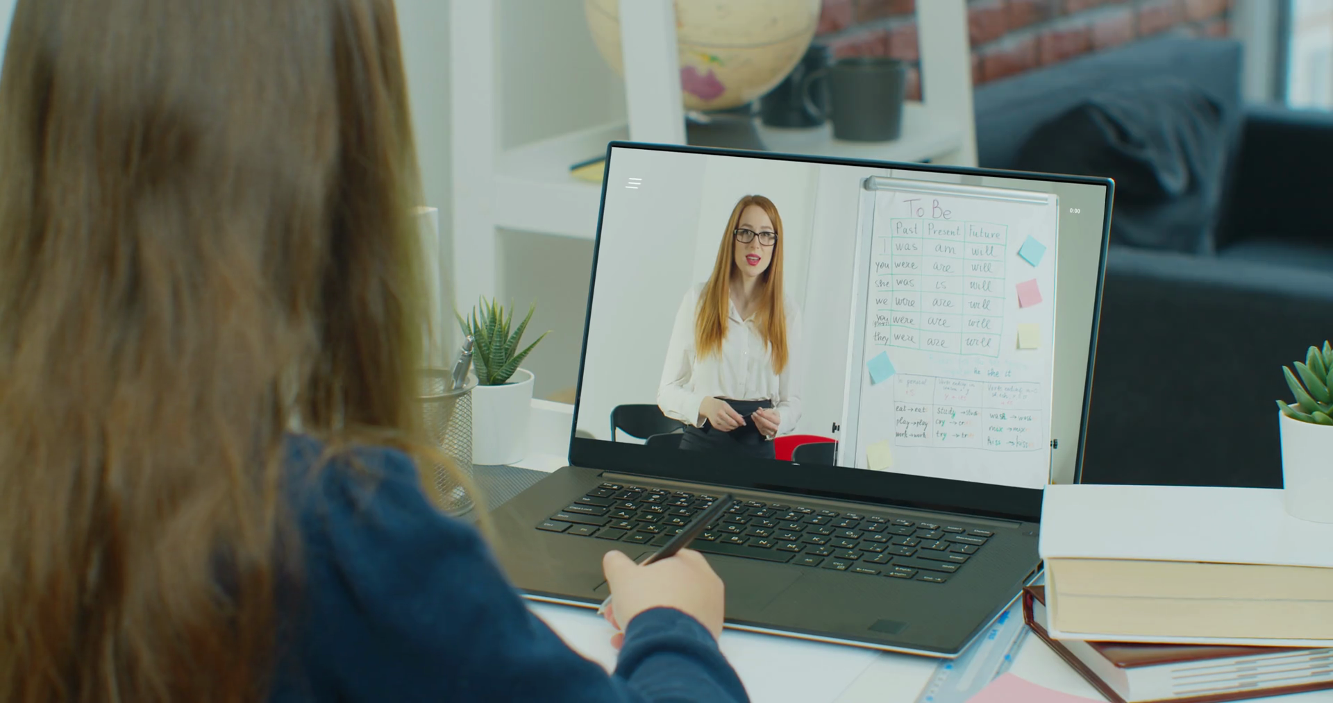 Distance teacher online tutor conferencing on laptop communicate with