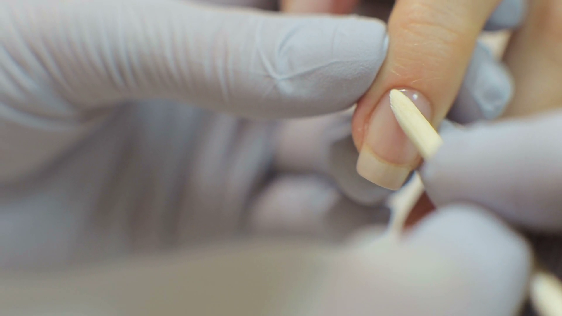 Nail Salon. Closeup Of Beautician Hands Cleaning Female Client's Nails