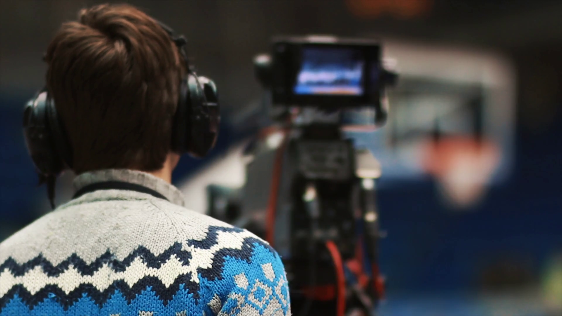 Back view on cameraman working on professional basketball sport event