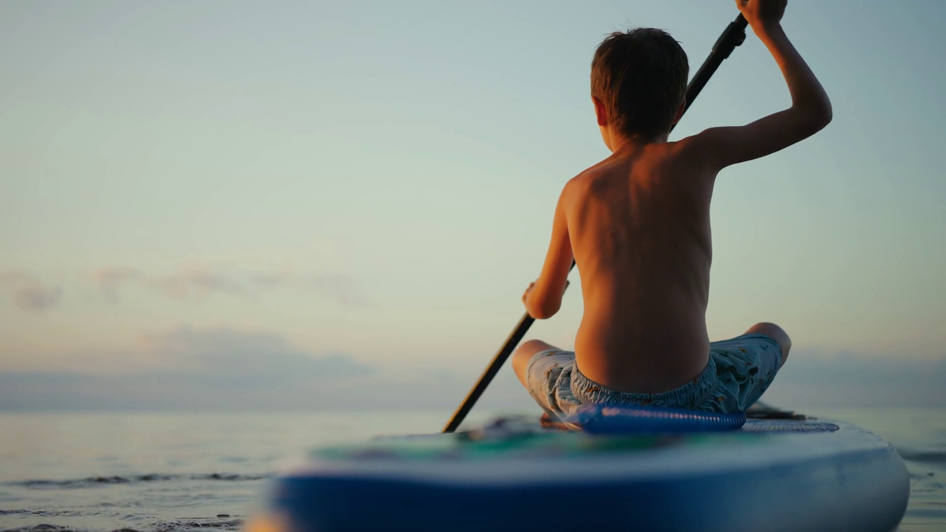 Silhouetted Paddleboarder Gliding Across Stock Footage SBV-352789524 ...