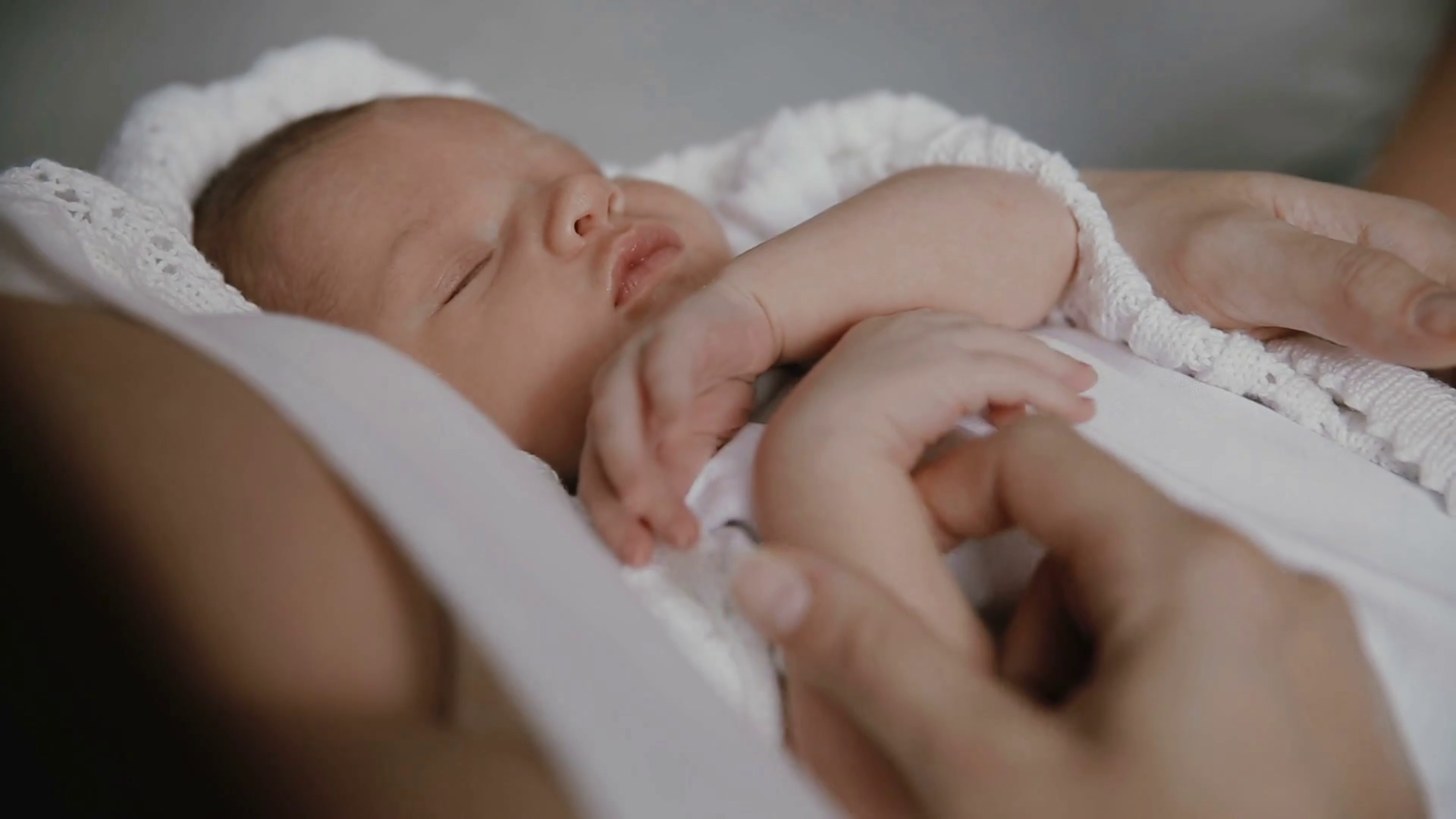 Newborn Baby Sleeps In Arms Of Mother Stock Footage SBV306124911