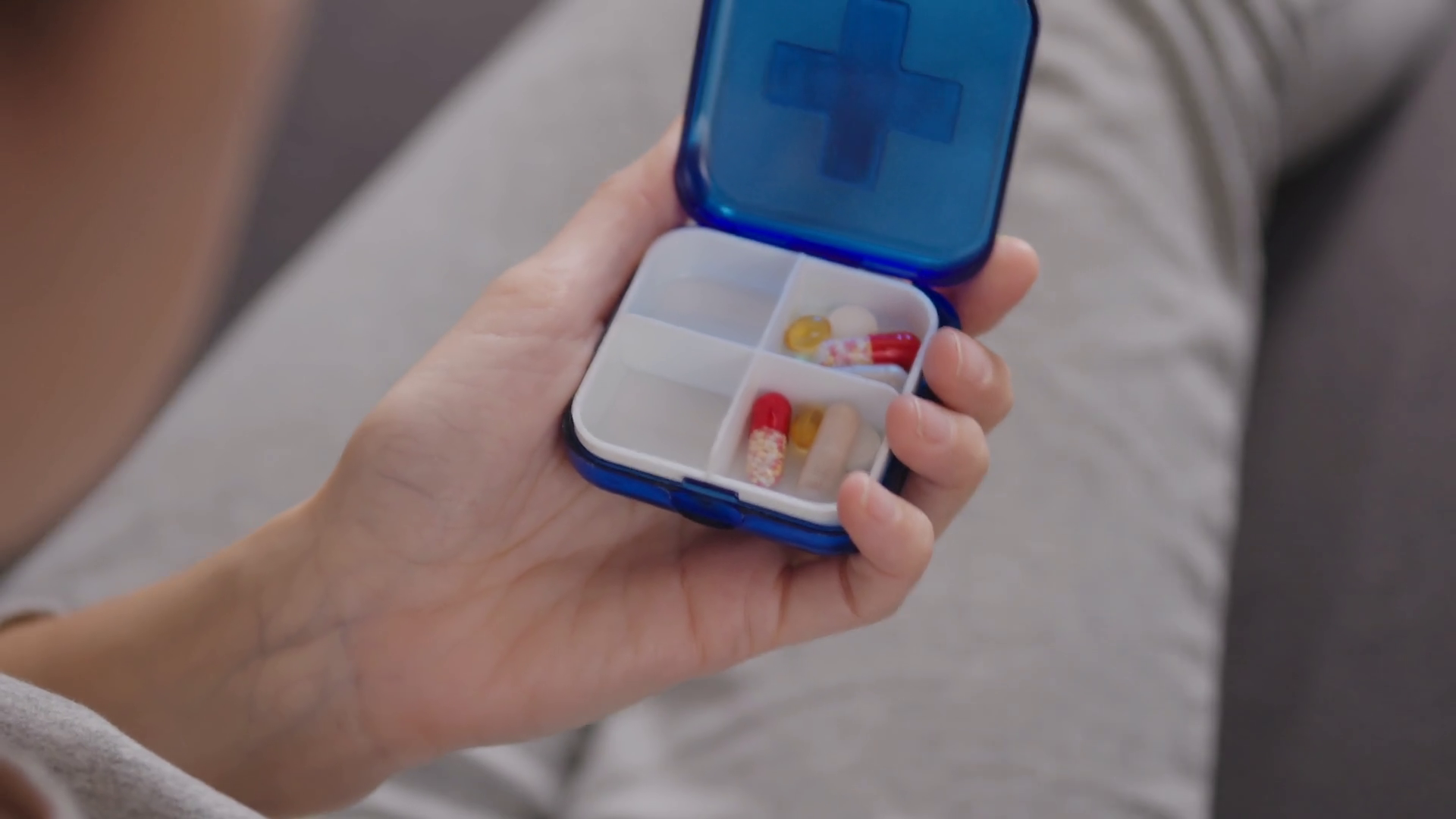 woman putting pills in a pill box Stock Video Footage 0018 SBV