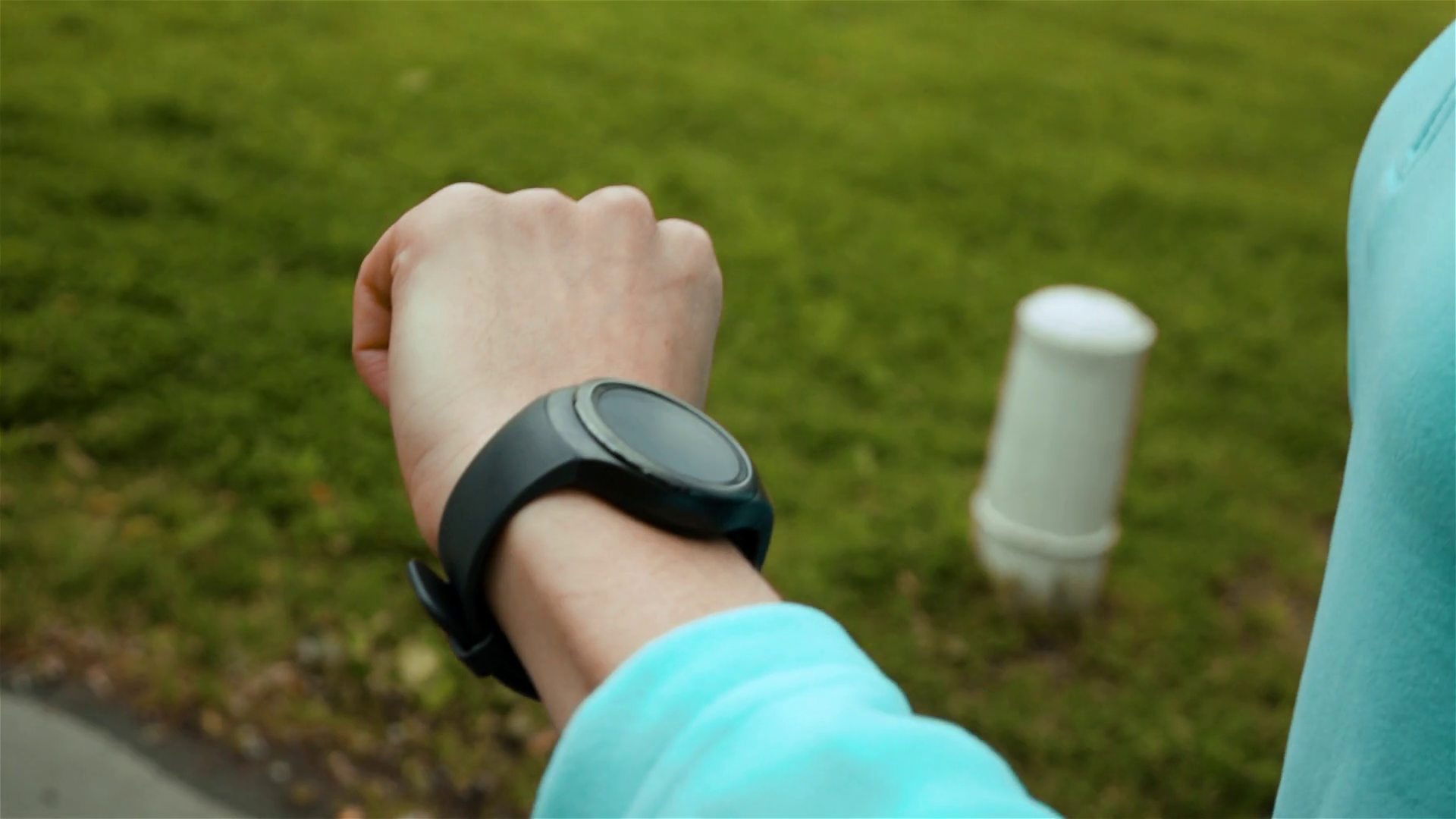 Runner using smart watch fitness tracker and heart rate monitor jogging