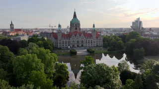 New City Hall of Hannover reflecting in water in the Morning, Aerial Drone Footage in Hannover, Germany