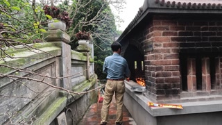 Burning Joss Paper in Hanoi Temple