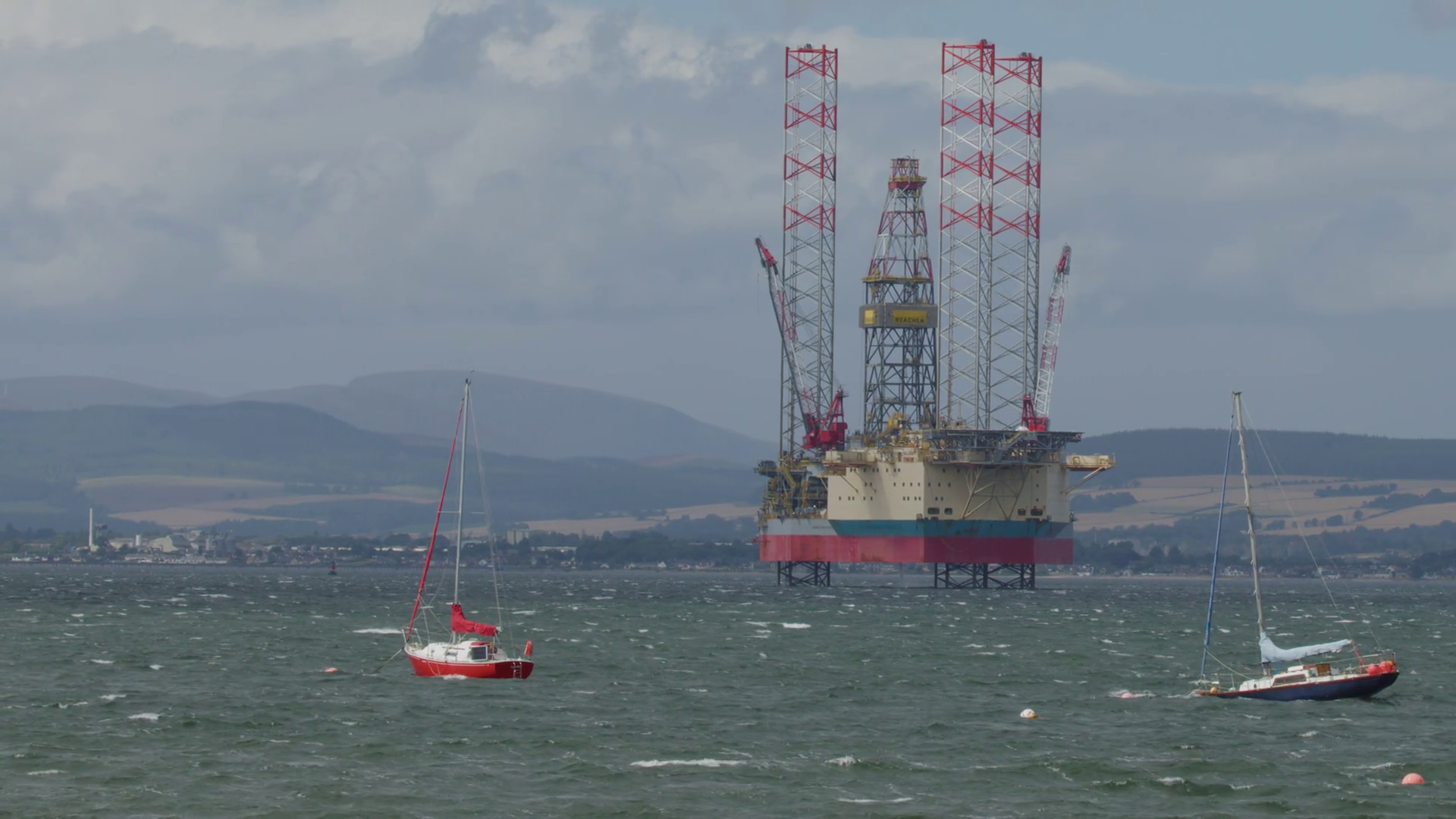 Sailboats Passing Offshore Oil Rig In Windy Stock Footage SBV-352781069 ...
