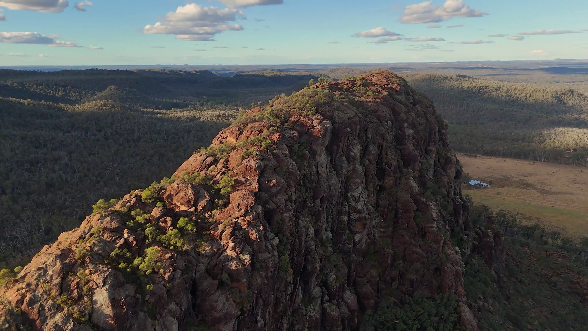Aerial Flyover Of Timor Rock Ridge At Sunset Stock Footage SBV ...