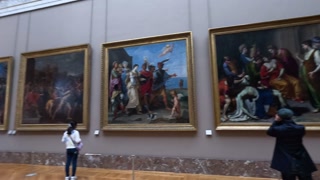Tourists Viewing Art at the Louvre