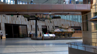Tourists View Military Aircraft and Armored Vehicles at Australian War Memorial