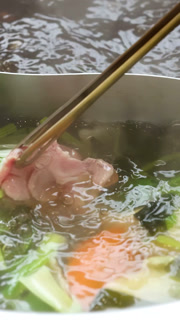 Chopsticks Cooking Beef Slice in Boiling Shabu Hotpot
