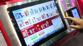 Man Operating a Digital Drink Dispenser