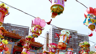 Vibrant Lanterns Against Urban Skyline