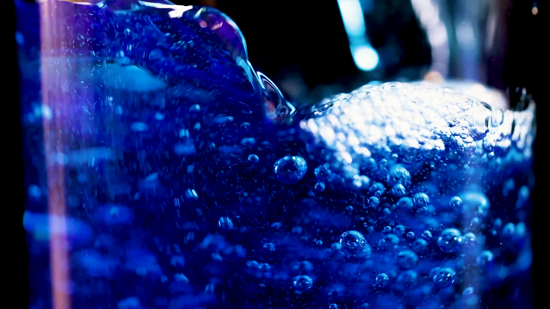 Blue Fizzy Drink Bubbling In Glass Stock Footage SBV-352402416 ...