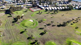 Aerial View of Coastal Golf Course Green and Fairway
