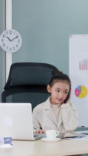 Young Asian Girl Roleplaying as a Business Executive in Modern Office