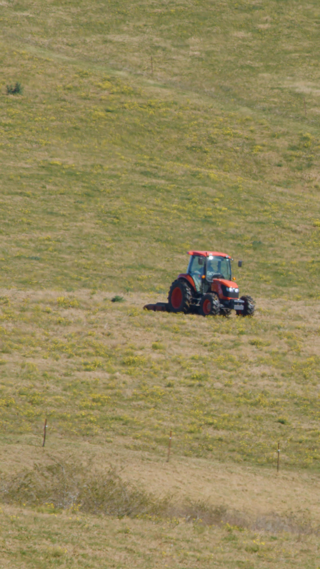 Red Tractor Moving Across Sunny Rural Field Stock Footage SBV-353137697 ...