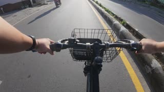 POV Bike Ride Through Urban Street