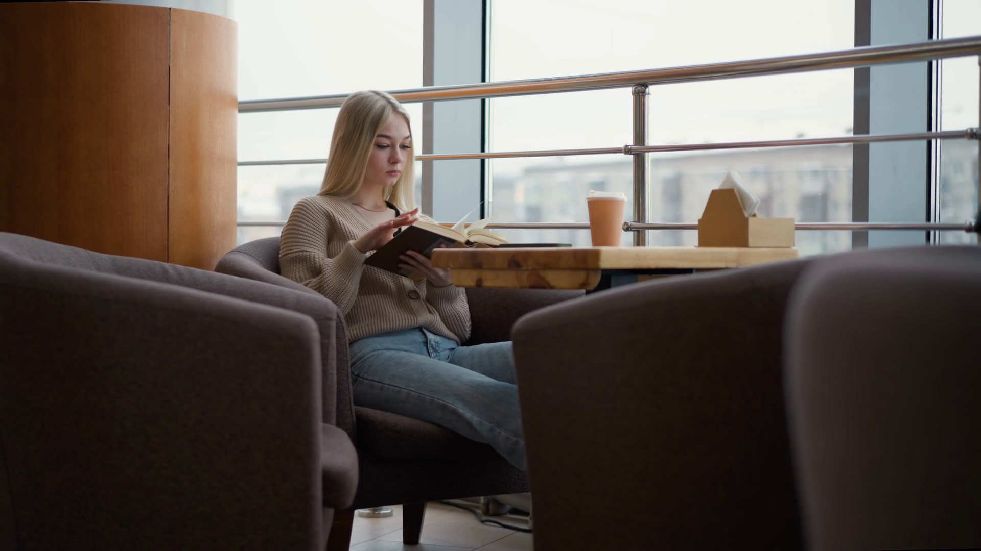 Woman Seated At Table Reading Book Holding Stock Footage SBV-351807941 ...